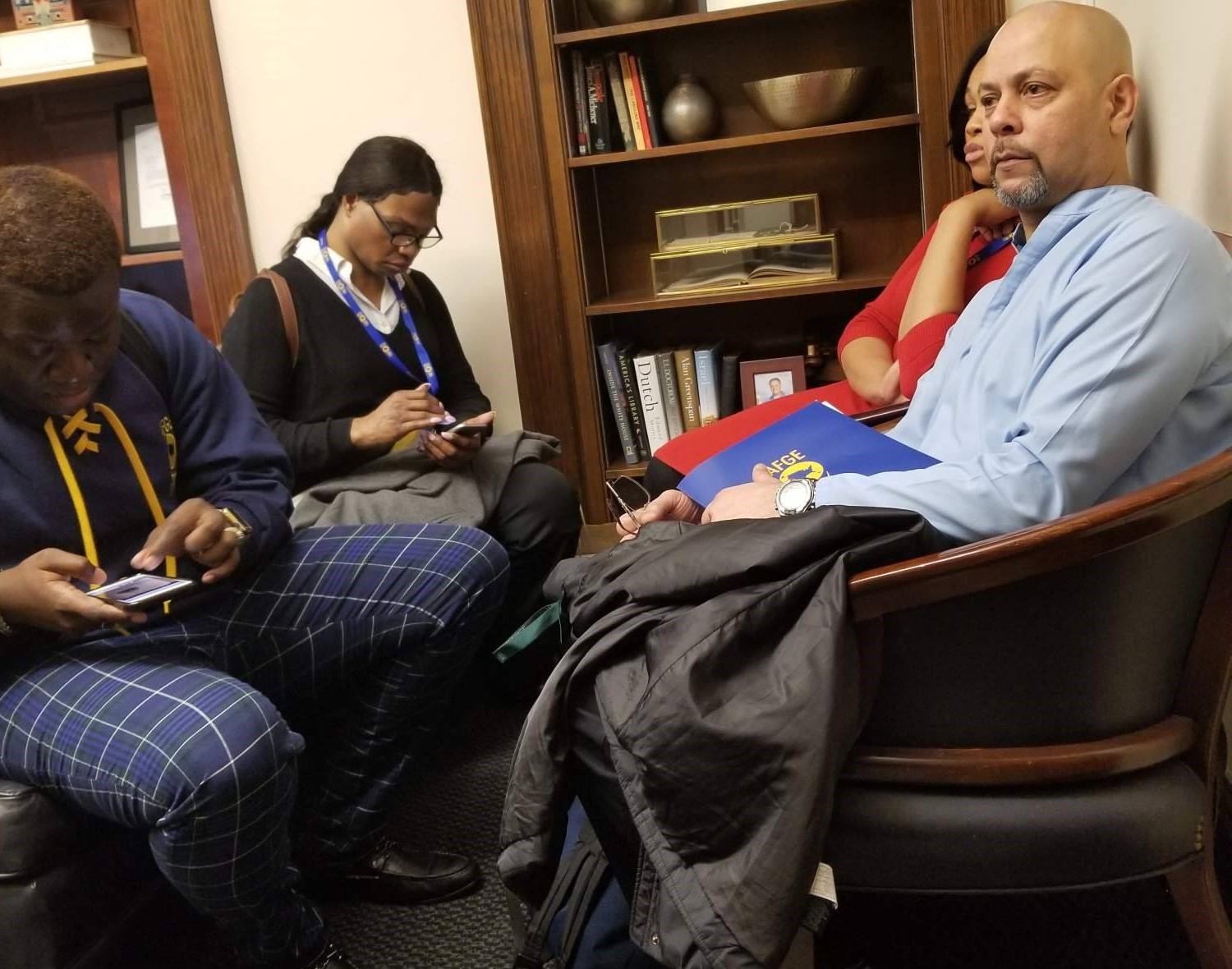 AFGE members in Rep. Ferguson's office Monday seated next to the book display.