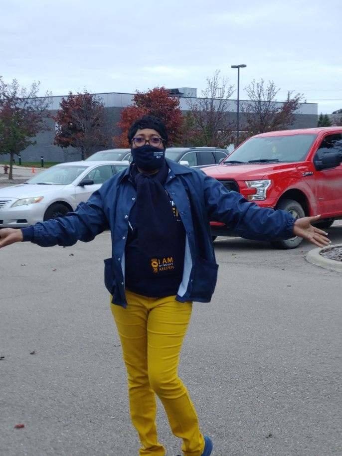 Woman standing in parking lot with AFGE gear on