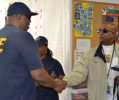 National Secretary-Treasurer Eugene Hudson Jr. greets staff and canvassers