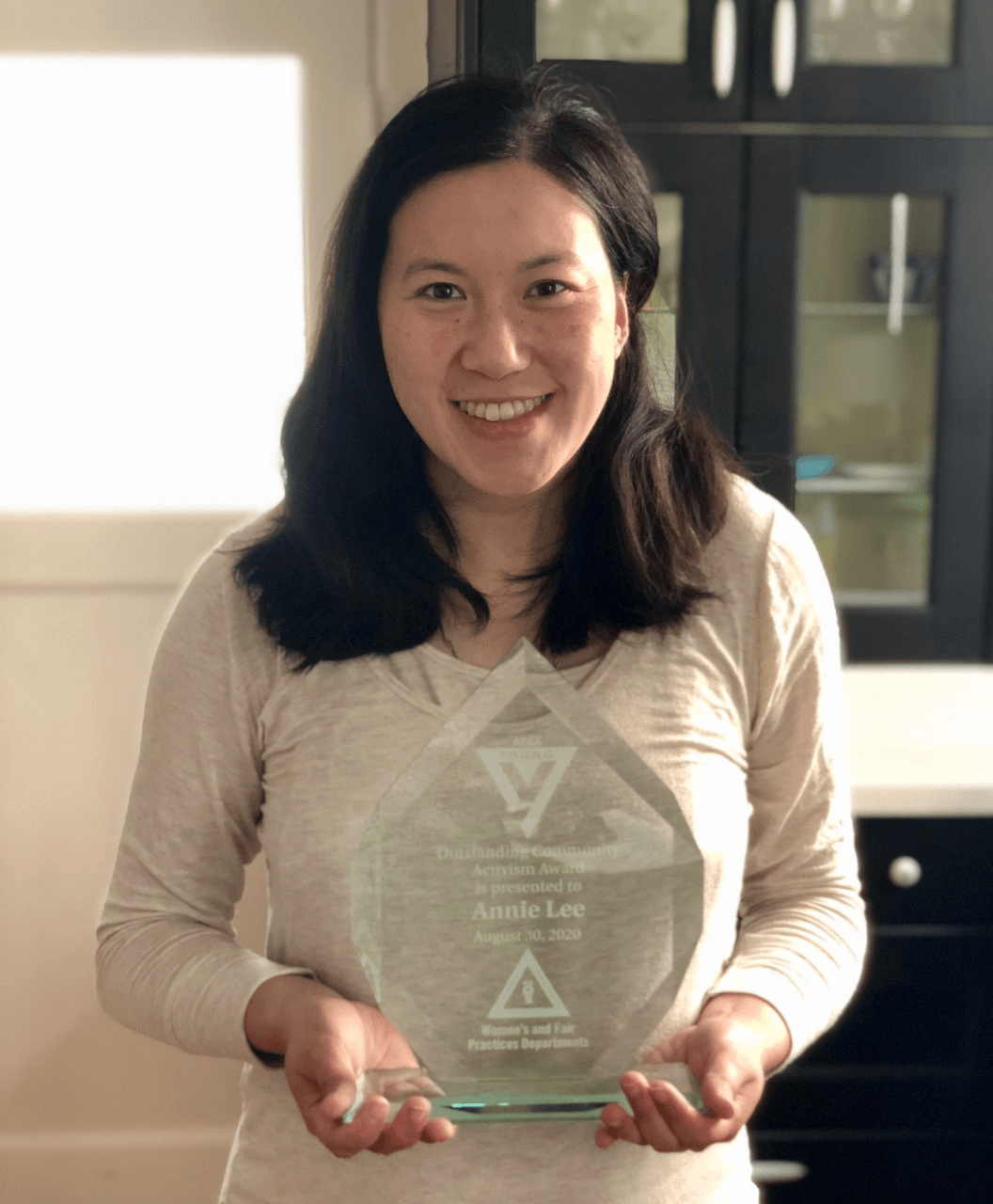 Annie Lee holding award