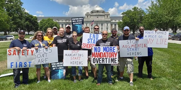 group of AFGE activists with rally signs