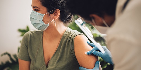 Woman receiving a vaccine shot