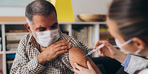 Person receiving a vaccine shot