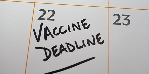Calendar with 22nd circled with text vaccine deadline