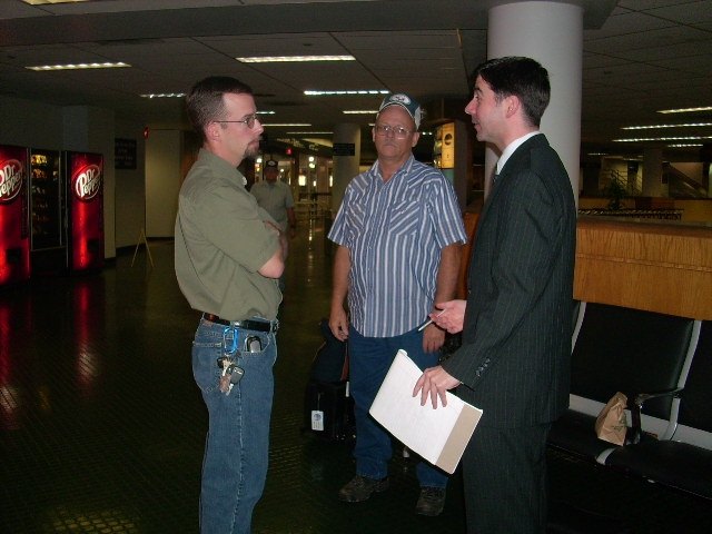 Chad Harris talking with workers