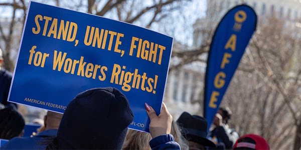 AFGE activist holding rally sign