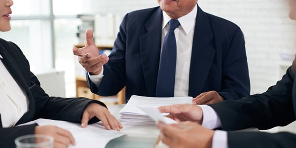 Workers at a conference table