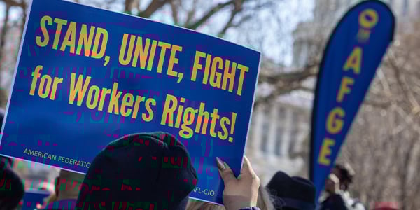 AFGE activist with rally sign