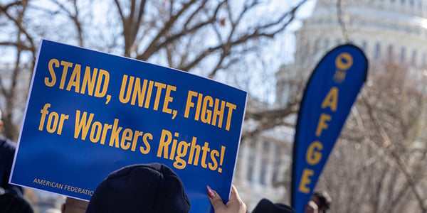 AFGE activist with rally sign