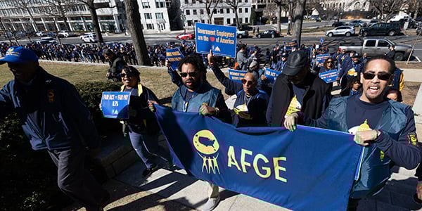AFGE activists holding rally signs