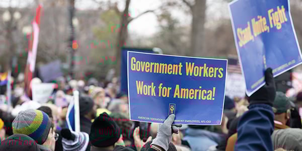 Rally sign that says Government Workers Work for America