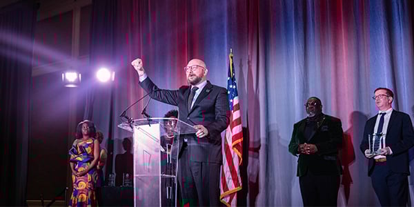 AFGE Membership Director at a podium receiving an award