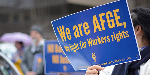 AFGE rally sign that reads We are AFGE, We fight for workers' rights
