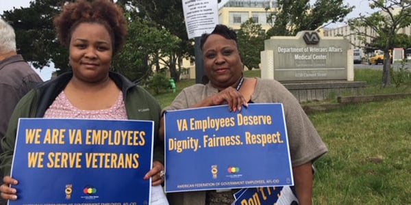 AFGE members with rally signs