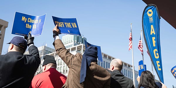 AFGE members with rally signs