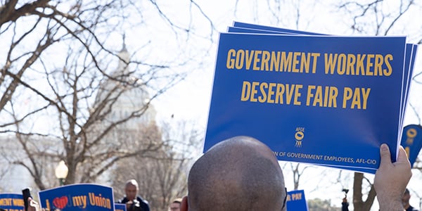 AFGE activist with rally sign